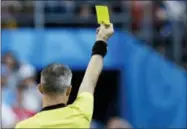  ?? VICTOR R. CAIVANO — THE ASSOCIATED PRESS FILE ?? In this Sunday file photo, referee Bjorn Kuipers from Netherland­s shows a yellow card to Russia’s Ilya Kutepov during the round of 16 match between Spain and Russia at the 2018 soccer World Cup at the Luzhniki Stadium in Moscow, Russia.