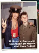  ??  ?? Richie and a young soldier backstage at the MoscowMusi­c Peace Festival.