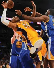  ?? NOAH GRAHAM/GETTY IMAGES ?? Kobe Bryant heads for a hard fall in Friday night’s game against the Warriors. Later, without contact, he suffered a torn left Achilles.