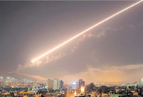  ??  ?? MISSILES LIGHT UP SKY: Damascus rocked by loud explosions and heavy smoke as US launched attacks on the Syrian capital yesterday in retaliatio­n for the alleged use of chemical weapons.