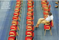  ??  ?? A man taking a siesta at the trading floor of the Colombo Stock Exchange