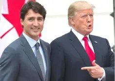  ??  ?? This file photo showsUS President Donald Trump (right) welcoming Canadian Prime Minister Justin Trudeau at the White House in Washington, DC. Canadian Prime Minister Justin Trudeau and US President Donald Trump spoke May 14, 2018 about the possibilit­y...