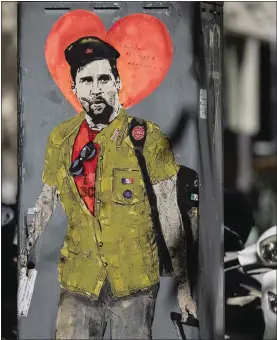  ??  ?? ‘Hasta siempre comandante’: street art in Barcelona depicts Messi