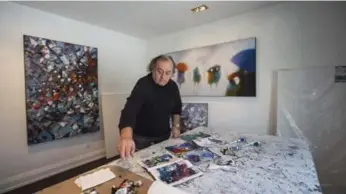  ?? BERNARD WEIL PHOTOS/TORONTO STAR ?? The living room serves as studio for artist Dragan Sekaric Shex, who uses a palette knife to create his oil canvases.