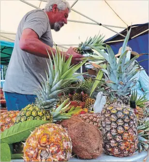  ??  ?? Fresh fruit makes Hanalei’s Saturday Farmers Market a visit worth savouring. Besides pineapples and coconuts, a local specialty is longan, a cousin of lychee fruit.