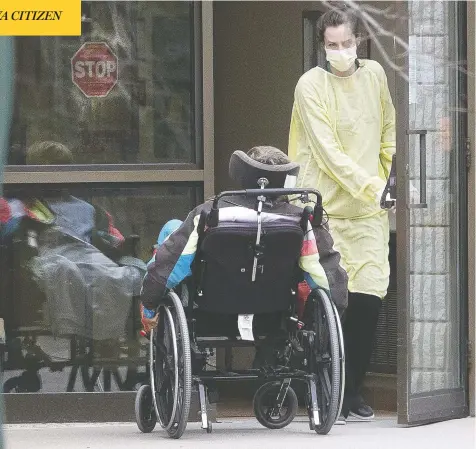  ?? STAN BEHAL / POSTMEDIA NEWS ?? A staff member helps a patient back into the Pinecrest Nursing Home in Bobcaygeon, Ont., northeast of Toronto, where a total of nine residents
have died of the coronaviru­s, including seven on the weekend. Long term care homes have proven to be hot spots of the pandemic in Canada.