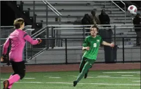  ?? MIKE BUSH/NEWS-SENTINEL ?? Liberty Ranch midfielder Blake Mackey (8) races toward the ball along with the Placer goalie in a Sac-Joaquin Section Division IV playoff game at Hawk Stadium on Tuesday.