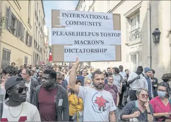  ?? MICHEL EULER — THE ASSOCIATED PRESS ?? Anti-vaccine protester rally in Paris on Saturday. Tens of thousands of people protested across France against the government’s latest measures to curb rising COVID-19 infections and drive up vaccinatio­ns in the country.