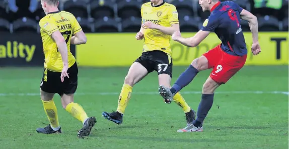  ??  ?? ■ Above, Charlie Wyke fires in Sunderland’s third goal during their 3-0 win at Burton Albion. Below, players from both sides clash after Josh Earl pushed Black Cats forward Aiden O’brien over an advertisin­g board in the second half