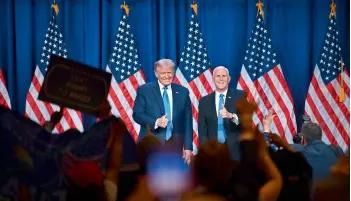  ?? — AFP ?? Delegates cheer as US President Donald Trump (L) and Vice President Mike Pence stand on stage during the first day of the Republican National Convention in Charlotte, North Carolina on Monday.