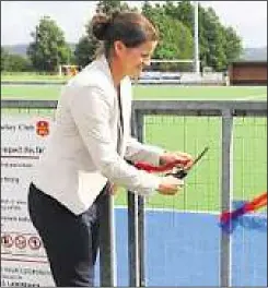  ??  ?? Jen Wilson opens the new pitch at Ashford Hockey Club
