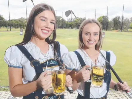  ?? Picture: RICHARD GOSLING ?? Tayla Marshall and Sophie Gray get in the Oktoberfes­t spirit at KDV Sport.