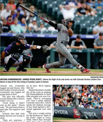  ?? ASSOCIATED PRESS ?? ARIZONA DIAMONDBAC­KS’ JARROD DYSON (RIGHT) follows the flight of his solo home run with Colorado Rockies catcher Dom Nunez to lead off the first inning of Tuesday’s game in Denver.