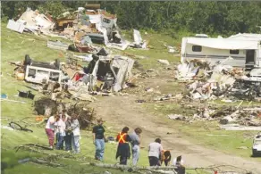  ?? BRENDON dlouhy/file ?? On July 14, 2000, a tornado swept through the Green Acre Campground in Pine Lake, killing 12 people and injuring 140.