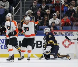  ?? JEFFREY T. BARNES — THE ASSOCIATED PRESS ?? Buffalo Sabres goalie Robin Lehner is scored on by Flyers forward Michael Raffl (12) in the third period.