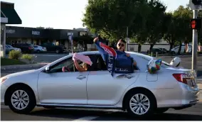  ?? RECORDER PHOTO BY ALEXIS ESPINOZA ?? Students from Strathmore High School were out celebratin­g their graduation during the senior cruise on Olive Avenue Friday evening.