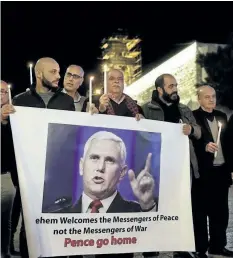  ?? MAHMOUD ILLEAN/THE ASSOCIATED PRESS ?? Palestinia­ns hold posters showing U.S. Vice-President Mike Pence during a protests against his visit near the Church of the Nativity in the West Bank city of Bethlehem, Sunday.