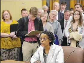  ?? Arkansas Democrat-Gazette/JOHN SYKES JR. ?? Ophthalmol­ogist Dr. Monica Hall (seated) voices her opposition Tuesday to House Bill 1251 that would allow optometris­ts to perform certain types of surgery. The House Public Health, Welfare and Labor Committee voted down the proposal.