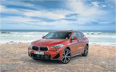  ??  ?? The design of the X2 definitely gives it more character than many rivals. Right: The rear has that coupelike crossover look and the return of the roundel on the C-pillar. Left: The interior is similar to its X1 sibling.