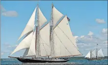  ?? SEAN D. ELLIOT/THE DAY ?? The schooners Columbia, left, and Mystic Whaler race for the first mark in last year’s Connecticu­t Martime Heritage Festival schooner race. The two schooners will be returning for this year’s festival.