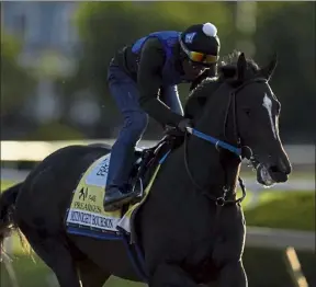  ?? Ap ?? Preakness entrant Midnight Bourbon works out during a training session ahead of the Preakness Stakes horse race at Pimlico race Course on Wednesday in Baltimore.