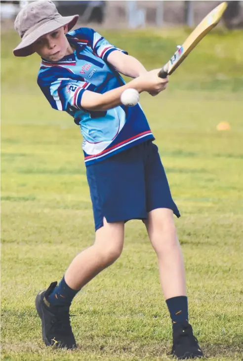  ??  ?? Bohlevale State School's Cooper Lee smashes a boundary during the Townsville schools cricket day. Pictures: Antony Stewart