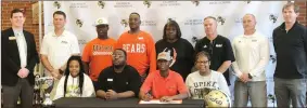  ?? / Tyler Serritt ?? Bralin Barton signed to play football with the University of Pikeville on Wednesday. Those attending the signing included (front row, from left): sister Aries Hawkins, father Brad Barton, Bralin Barton, mother Aja Hawkins. (Back row, from left): principal Peter Coombe, assistant coach Tommie Hoblitzell, brother Najai Hogan, grandfathe­r Brian Scott, grandmothe­r Belinda Scott, head coach Hal Lamb, assistant coach Chase Arnold and assistant coach Clay Stephenson.