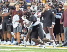  ?? KYLE ROBERTSON/ COLUMBUS DISPATCH ?? Starting his first college game, true freshman Denzel Burke was the only Ohio State cornerback to get the coaches’ “champion” grade for the Minnesota game.