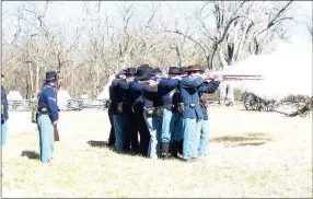  ?? TIMES file photograph ?? Flames shot from rifle barrels as Union soldier re-enactors of Company B, 24th Missouri, fired a volley while demonstrat­ing infantry maneuvers. Artillery demonstrat­ions are slated for Saturday, June 9.