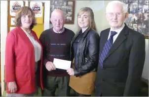  ??  ?? The winner of the 2018 Sean Moylan Scholarshi­p, Ballydesmo­nd student Karina Cronin with Pat O’Brien (chair) and Maurice O’Riordan (secretary) of the trustees committee and her proud mother Mairéad.