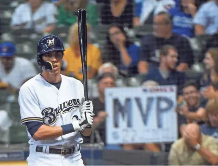  ?? jsonline.com/brewers. BENNY SIEU / USA TODAY SPORTS ?? National League MVP candidate Christian Yelich, who hit for the cycle Monday, prepares to bat Tuesday night against the Reds. The game ended too late for this edition. For full game coverage, and also a look at the MVP credential­s for Yelich and other candidates, go to