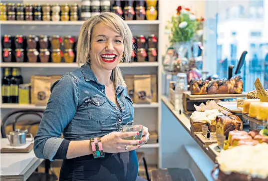  ??  ?? Surrounded by temptation: Kate Quilton may be in the midst of delicious foodstuffs at Honey & Co, but some treats are off the menu now that she is expecting her first child