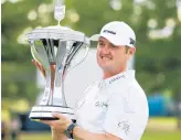  ?? MICHAEL WYKE/AP ?? Jason Kokrak holds the trophy after winning the Houston Open on Sunday.