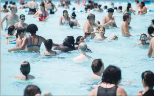  ?? CP PHOTO ?? People cool down in a public pool in Montreal, Thursday.