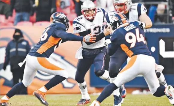  ??  ?? Broncos outside linebacker Shane Ray sacks Patriots quarterbac­k Tom Brady during last Sunday’s game in Denver. Ray, a former Missouri star who was a first-round pick in the 2015 draft, has 11 sacks in his NFL career — including seven this season. Helen...