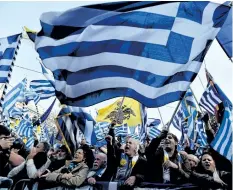  ?? VALERIE GACHE/AFP/GETTY IMAGES ?? People take part in a demonstrat­ion Sunday in Athens to urge the Greek government not to compromise in the festering name row with neighbouri­ng Macedonia over the name of the country.