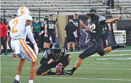  ?? AP PHOTO/GEORGE WALKER IV ?? Vanderbilt’s Sarah Fuller kicks an extra point during the first quarter of Saturday’s home game against Tennessee, becoming the first female football player to score in a Power Five game in the process. Fuller made a second extra point late in the game.