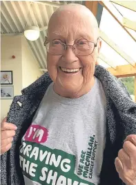  ??  ?? Above left and below: May Smith has her head shaved by Noela Watson for Macmillan Nurses. Above right: she shows off the end result.