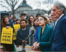  ?? Pete Marovich / New York Times ?? Rep. Alexandria Ocasio-Cortez, D-N.Y., and Sen. Ed Markey, D-Mass., call for a sweeping environmen­tal and economic mobilizati­on.