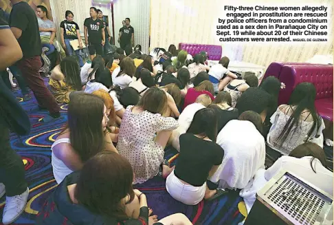  ?? MIGUEL DE GUZMAN ?? Fifty-three Chinese women allegedly engaged in prostituti­on are rescued by police officers from a condominiu­m used as a sex den in Parañaque City on Sept. 19 while about 20 of their Chinese customers were arrested.