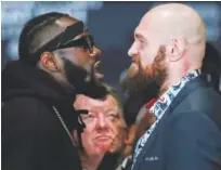  ?? Reuters ?? Deontay Wilder and Tyson Fury square up during the press conference in Washington on Wednesday.