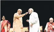  ?? ARVIND YADAV/HT PHOTO ?? ■ BJP president Amit Shah offers sweets to Prime Minister Narendra Modi at the party’s parliament­ary party meeting in New Delhi on Tuesday.