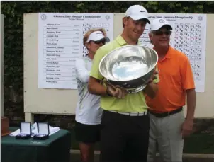  ?? The Sentinel-Record file photo ?? DEFENDING CHAMPION: Austin Eoff receives the E.B. Gee Trophy as 2016 Arkansas State Golf Associatio­n state amateur champion at Hot Springs Country Club. The Benton native and former Purdue golfer is two-time defending champion in the annual tournament,...