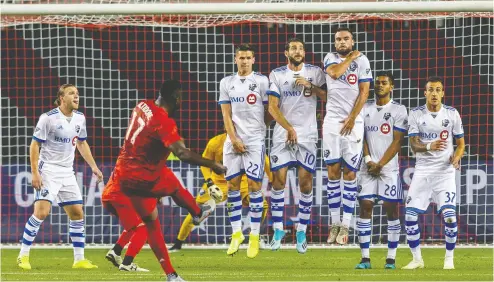  ?? evin Sousa / USA TODAY ?? Toronto FC forward Jozy Altidore fails to score a free kick against the Montreal Impact at Wednesday’s Canadian Championsh­ip at BMO Field. With the win Montreal cements a spot in next year’s CONCACAF Champions League.