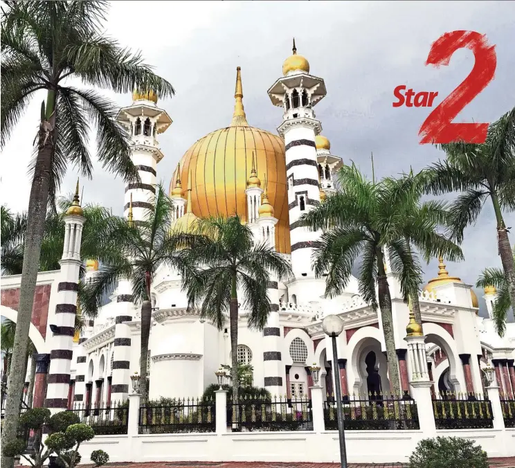  ?? — MING TEOH/The Star ?? The iconic Ubudiah Mosque stands majestical­ly in Kuala Kangsar, with its golden domes and minarets.