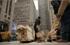  ?? HABITAT FOR HUMANITY — STEFFAN HACKER VIA AP ?? Lumber milled from the 2010 Rockefelle­r Center Christmas tree being stacked for constructi­on of a Habitat for Humanity house in Newburgh, N.Y. Boards from last year’s 2016 tree, a 94-foot Norway spruce, were trucked 50 miles north again to Newburgh,...