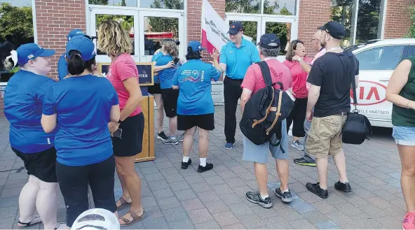  ??  ?? ABOVE AND BELOW RIGHT: Ted Lancaster, Kia Canada’s vice-president and COO , assists in the Special Olympics Canada 2018 summer games medal ceremony in Antigonish, N.S.