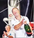  ?? AFP ?? Francis Joyon celebrates onboard his yacht in Guadeloupe after winning the Route du Rhum solo sailing race on Monday.