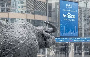  ?? ?? A screen shows a message marking the listing of the Chinese search engine operator Baidu Inc on the Hong Kong Stock Exchange on March 23 last year.