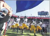  ?? KARL MONDON — BAY AREA NEWS GROUP, FILE ?? Cal takes the field for the 122nd Big Game on Nov. 23, 2019, at Stanford Stadium in Stanford. The Pac-12ended a six-month shutdown Thursday.